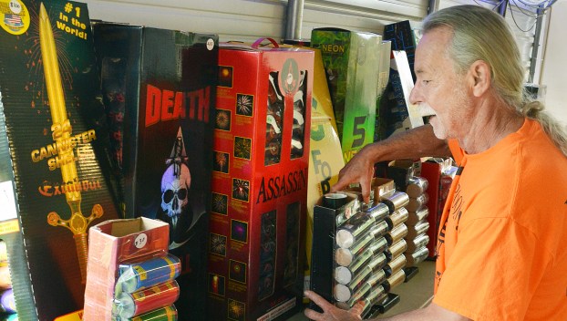 Ray Boone, owner of Fourth Street Fireworks and Little Sign Shoppe, keeps a supply of large artillary shells in his fireworks booth. He said safety protocol is very important when enjoying backyard fireworks. (Photo by Robin Hart)