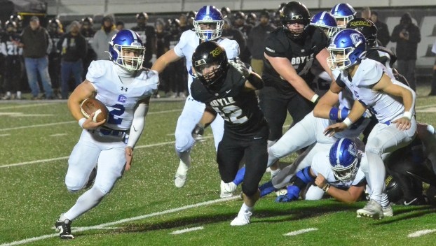 Cash Harney (2) of Covington Catholic gets to the outside as Boyle County defender Gage Feltner gives chase during the second quarter Friday. Harney rushed for 234 yards on 32 attempts.