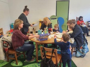 Families complete activities together through the Cradle School program. (Photo Submitted)