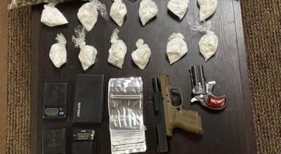 Items seized by police included marijuana, cocaine, U.S. currency and firearms. (Photo submitted)