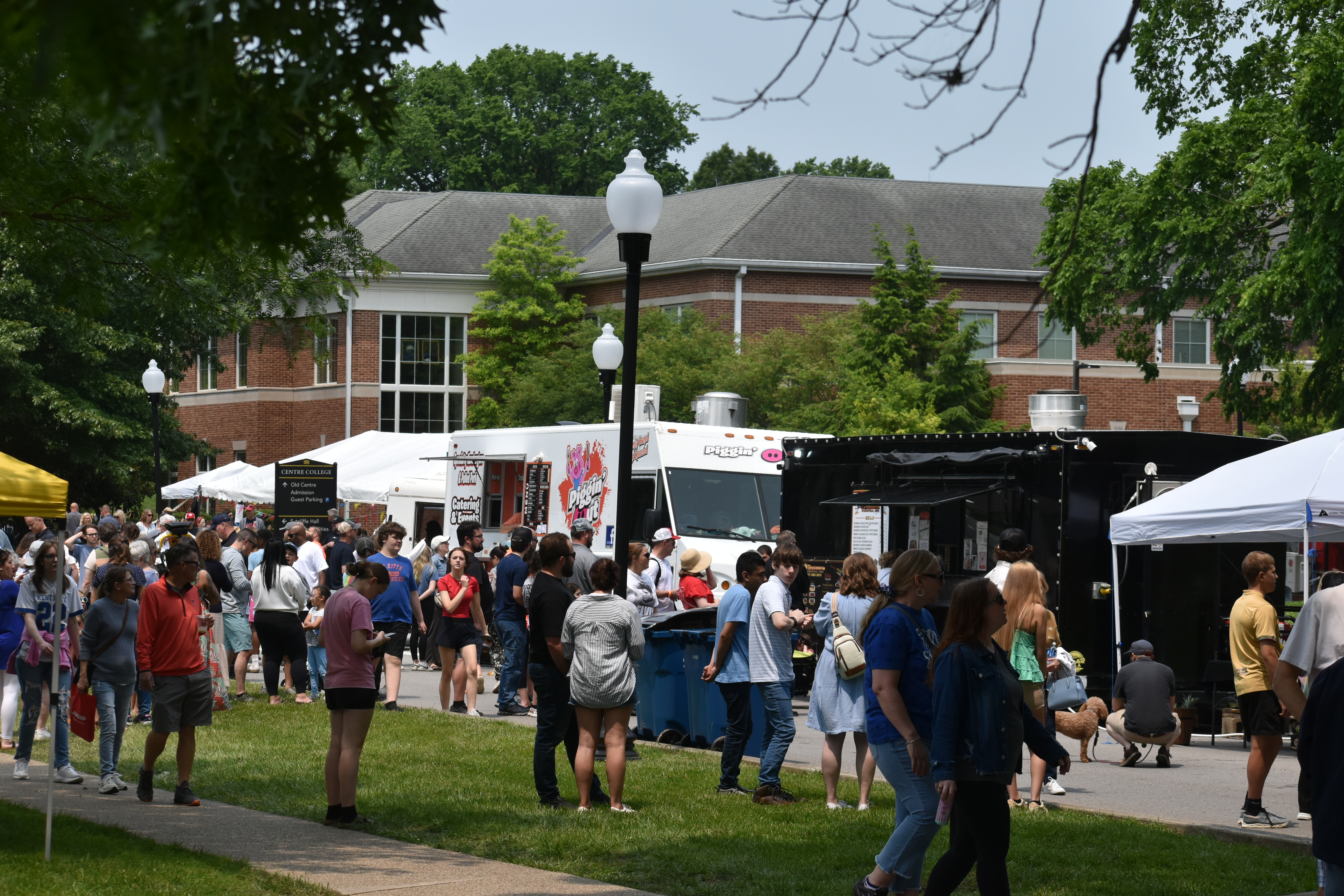 Festival goers enjoy a variety of food truck offerings during the Great American Brass Band Festival in downtown Danville on Saturday, May 31, 2025. (Photo by Josely Labarrere)