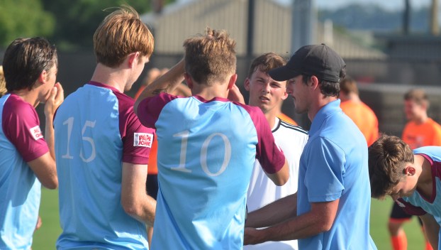 Danville Locomotive coach Tate Spivey talks with his players prior to the start of their game Sunday. (Photo by Mike Marsee)