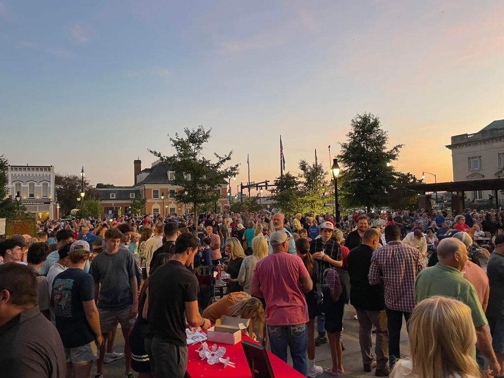 Mourners gather at a candle light vigil for Charlie Kirk last week in Danville. (Photo By Eben Henson)