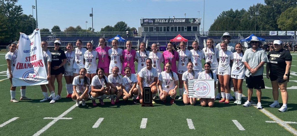 Boyle County players and coaches pose with their trophy after the Lady Rebels defeated Johnson Central on Sunday to win the Kentucky 2A Championships for the second straight year. (Photo Submitted)